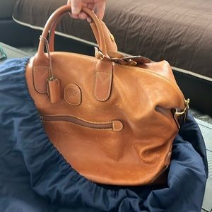 Bric’s duffel bag and tan.